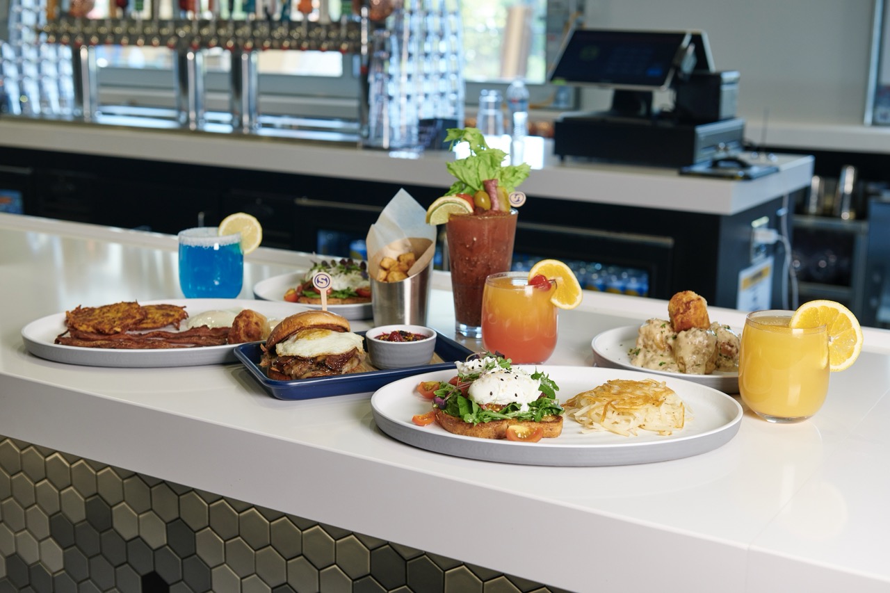 brunch items set out on counter top, bloody mary, eggs, specialty cocktails